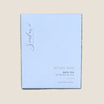 A square white box of Sealuxe Organics Ritual Rose Bath Tea. The box features elegant black cursive branding and gold text indicating the product name and scent.