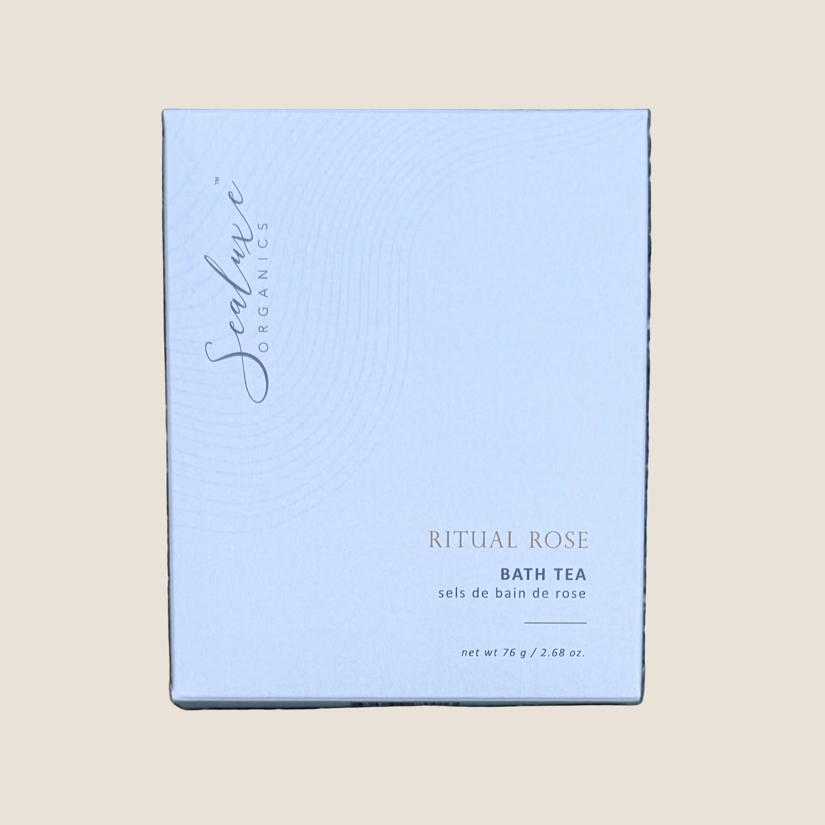 A square white box of Sealuxe Organics Ritual Rose Bath Tea. The box features elegant black cursive branding and gold text indicating the product name and scent.