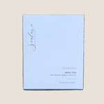 A square white box of Sealuxe Organics Seaweed Bath Tea. The box features elegant black cursive branding and gold text indicating the product name and type.