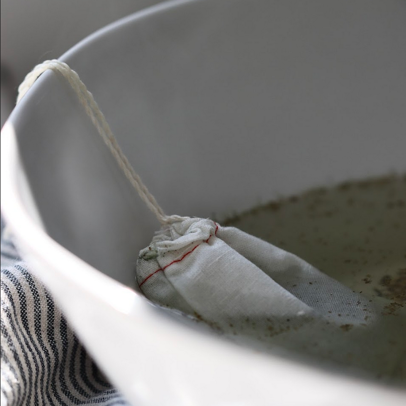 how to use a bath tea with the salts and botanicals added to a muslin tea bag and steeped in a hot bath of water 