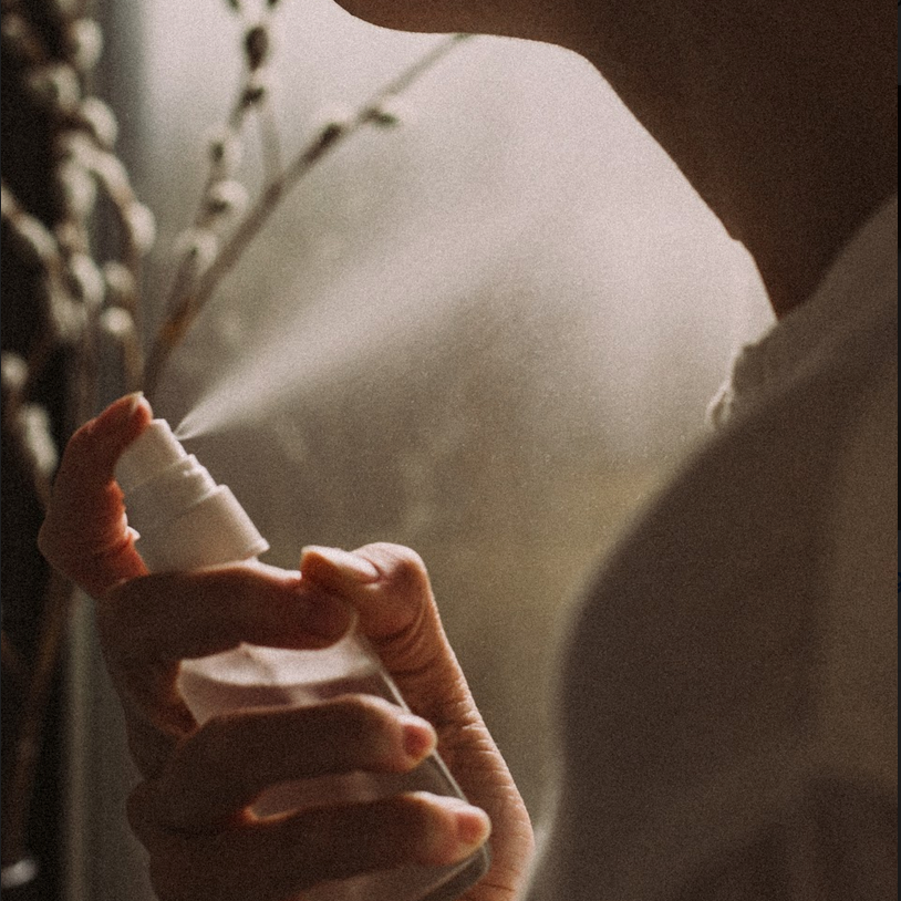 spraying Sealuxe's rose and seaweed toner on neck