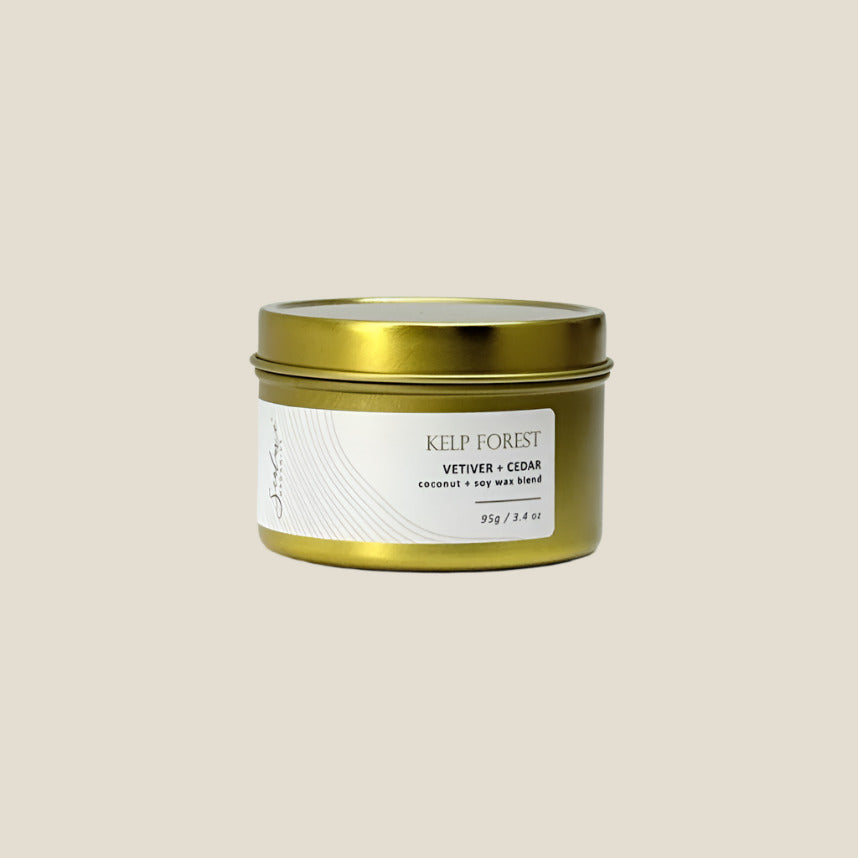 Gold candle tin labeled 'Kelp Forest' on a white background